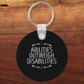 Vermogen weegt zwaarder dan handicaps 0 handicaps sleutelhanger (Achterkant)