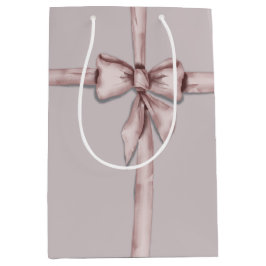 Verpakt in een roze strik medium cadeauzakje