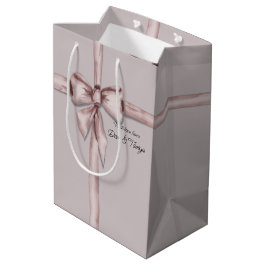 Verpakt in een roze strik medium cadeauzakje