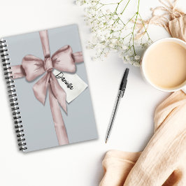 Verpakt in een roze strik notitieboek