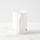 Verpleegster die koffiepauze neemt porselein kop (Achterkant)