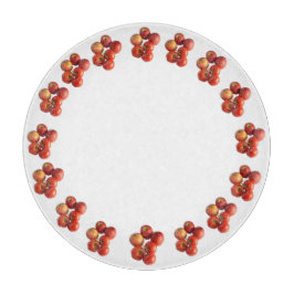 Verse appels en tomaten ronde glazen snijplank