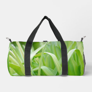 Verse groene plantenbladeren plunjezak