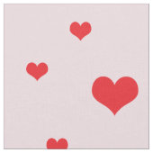 Verspreide Rode Harten op Lichtroze Kleur Stof (Close Up)