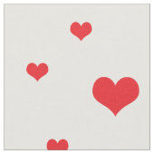 Verspreide rode harten witte achtergrond stof (Close Up)