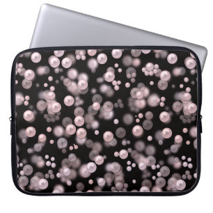 Verspreiding van roze en witte parels op zwarte ve laptop sleeve