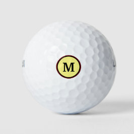 Vet monogram in twee cirkels en gele achtergrond golfballen