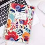 Vetgedrukte rode Sinaasappels bloemmotief geperson Planner<br><div class="desc">Personaliseer deze planner met jouw naam in zwarte cursief omlijst door een witte rechthoek,  op een gedurfd,  kleurrijk patroon van rode,  oranje en paarse bloemen op een beige achtergrond.</div>