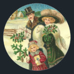 Victorian family in the snow Christmas scene Ronde Sticker<br><div class="desc">Vintage illustration of a Victorian family with Christmas gifts and present,  walking in a winter wonderland covered with snow.</div>
