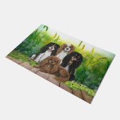 Vier Cavalier King Charles Spaniels in Flowers do Deurmat (Schuin)