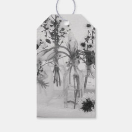 Vier flessen en witte bloemen cadeaulabel