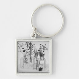 Vier flessen en witte bloemen sleutelhanger