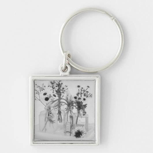 Vier flessen en witte bloemen sleutelhanger (Voorkant)