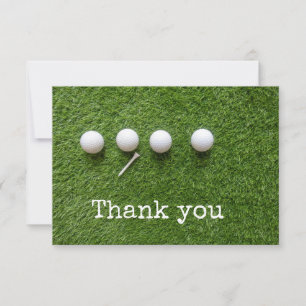 Vier golfballen met tee op groen gras bedankkaart