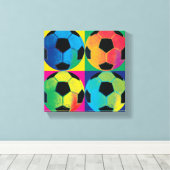 Vier Voetballen in verschillende kleuren Canvas Afdruk (Insitu (Houten vloer))