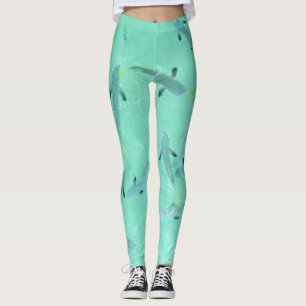 Viji zwemmen in helder blauw water leggings