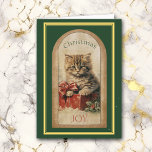 Vintage Afbeelding Tabby Kitten Kerstcadeau Kaart<br><div class="desc">De voorkant van dit kerst wenskaart heeft een prachtige vintage afbeelding van een schattig tabby kitten zittend op een rode geschenkdoos met een boog. In de bijpassende tekst staat "Christmas JOY". Het afbeelding is begrensd in donkergroen met een gouden en groene lijst. De binnenkant van de kaart heeft links de...</div>