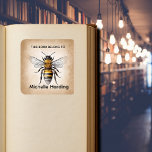 Vintage Bee Bookplate | “This Book Belongs To” Per Vierkante Sticker<br><div class="desc">Add a charming touch to your personal library with this Vintage Bee Bookplate. Featuring a classic antique-style bee illustration, this book label is perfect for marking your favorite books while adding timeless character to your collection. Inspired by vintage botanical and natural history designs, this bookplate makes a wonderful gift for...</div>