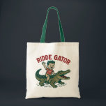 Vintage Florida Kitsch Ridde Gator Retro Alligator Tote Bag<br><div class="desc">Channel the spirit of the swamp with this Ridde Gator souvenir tote bag. Inspired by mid-century roadside attractions and retro Florida mascots, this "ridiculous" design features our favorite mossy resident in all his kitschy glory. Whether you’re a fan of swamp core aesthetics or just love a good "ugly-cool" vintage style...</div>