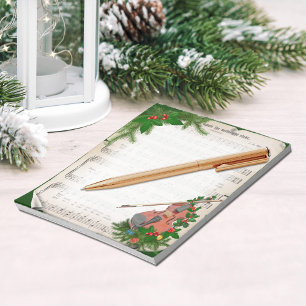 Vintage kerstblad muziek met feestelijk geweld notitieblok