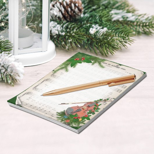 Vintage kerstblad muziek met feestelijk geweld notitieblok