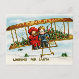 Vintage kerstkinderen die op zoek zijn naar de ker feestdagenkaart