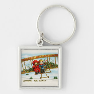Vintage kerstkinderen die op zoek zijn naar de ker sleutelhanger