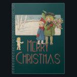 Vintage-kerstkinderen en Cherub Notitieboek<br><div class="desc">Vintage kerstkinderen en Cherub... wat een mooie kleine gek van een kerstgroet. Twee kinderen die kerstbloemen brengen, worden benaderd door een kerstkerker. "Vrolijk kerstfeest" staat er. Deze charmante illustratie voor kerstkinderen is gebaseerd op een postkaart uit 1920. De illustratie van de kerstkinderen is heel mooi. Ze hebben kleine kerstmantels aan....</div>