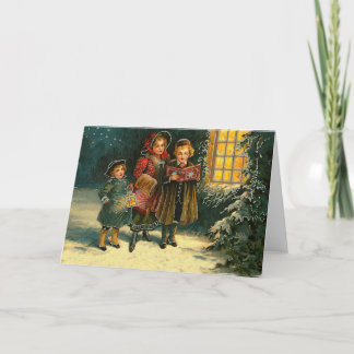 Vintage kerstkinderen met carolzangers feestdagen kaart
