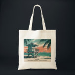Vintage Miami Florida South Beach Skyline Travel Tote Bag<br><div class="desc">Celebrate the vibrant character of Miami with this vintage South Beach skyline artwork. A colorful lifeguard tower rises above golden sands and turquoise waves, framed by lush tropical palms and glowing sunset skies. Inspired by retro travel posters, this pastel-toned illustration captures the laid-back atmosphere and timeless charm of Florida’s most...</div>