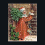 Vintage Santa Claus in Orange Robe - Christmas Feestdagenkaart<br><div class="desc">In Merry Christmas. Vintage Xmas image from an antique postcard ca. 1910. Santa has on an oranange jurk and has a tree over his shoulder. He is carrying a small bag of toys, knocking on an old wooden door. Very European style Santa. Most Christmas cards in the early 1900s were...</div>