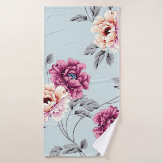 violet en geel bloemen met een bladpatroon op b badhanddoek