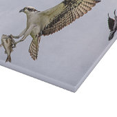 Visarend die door een rode gevleugelde merel snijplank (Hoek)