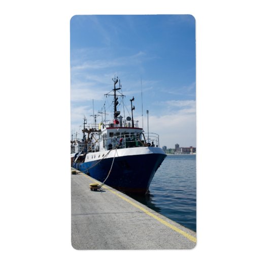 Vissende boot bij aanmeren etiket (Voorkant)