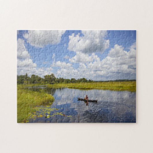 Visser op een meer in Guyana. Legpuzzel (Horizontaal)