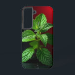 Vivid Mint Plant Macro – Botanisch Groen op Zwart Samsung Galaxy Hoesje<br><div class="desc">Breng een frisse adem en de elegantie van de natuur in uw ruimte met deze levendige macrofoto van een munt plant. Opgenomen in verbluffende details, laat de frisse groene pop dramatisch achter tegen een humeurige zwarte achtergrond met een opvallende rode gradiënt. Ideaal voor keukeninrichting, geschenken met een kruidenthema, botanische liefhebbers...</div>