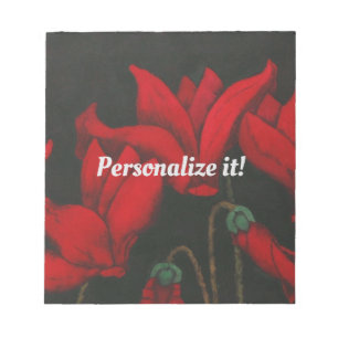 Vivid red Cyclamen op een donkere zwarte achtergro Notitieblok