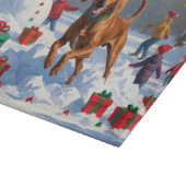 Vizsla hardlopend in de sneeuw met kerstmuts snijplank (Hoek)