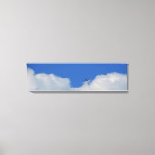 Vlak met wolken Panoramische Canvas Print (Voorkant)