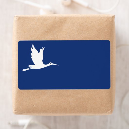 Vliegende witte ooievaar etiket (Insitu)