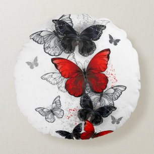 Vliegende Zwarte en Rode Morpho Vlinders Rond Kussen