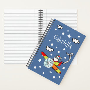 Vliegtuig voor kerstkerstkerstmis met een persoonl notitieboek