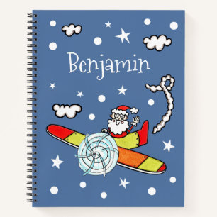 Vliegtuig voor kerstkerstkerstmis met een persoonl notitieboek