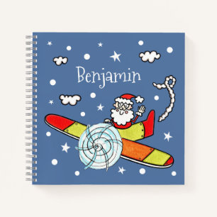 Vliegtuig voor kerstkerstkerstmis met een persoonl notitieboek