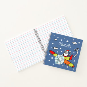Vliegtuig voor kerstkerstkerstmis met een persoonl notitieboek