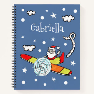 Vliegtuig voor kerstkerstkerstmis met een persoonl notitieboek