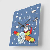 Vliegtuig voor kerstkerstkerstmis met een persoonl vierkante klok (Hoek)