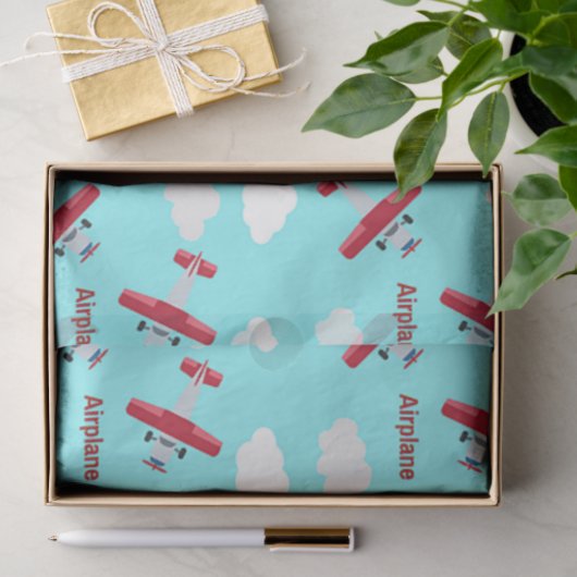 Vliegtuigpatroon op blauw tissuepapier (Geschenk)