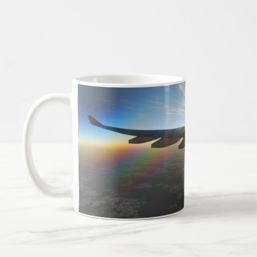 Vliegtuigvleugel tegen Mok ondergaande zon (Links)