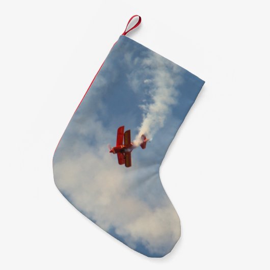 Vliegtuigvliegtuig tegen de presentatiestunt kleine kerstsok (Voorkant (Hangend))